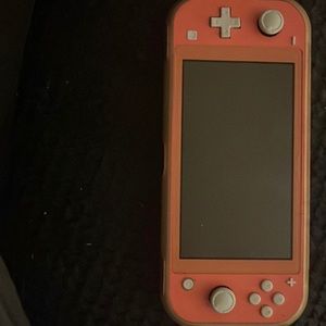 nintendo switch lite with mario game (best offer)